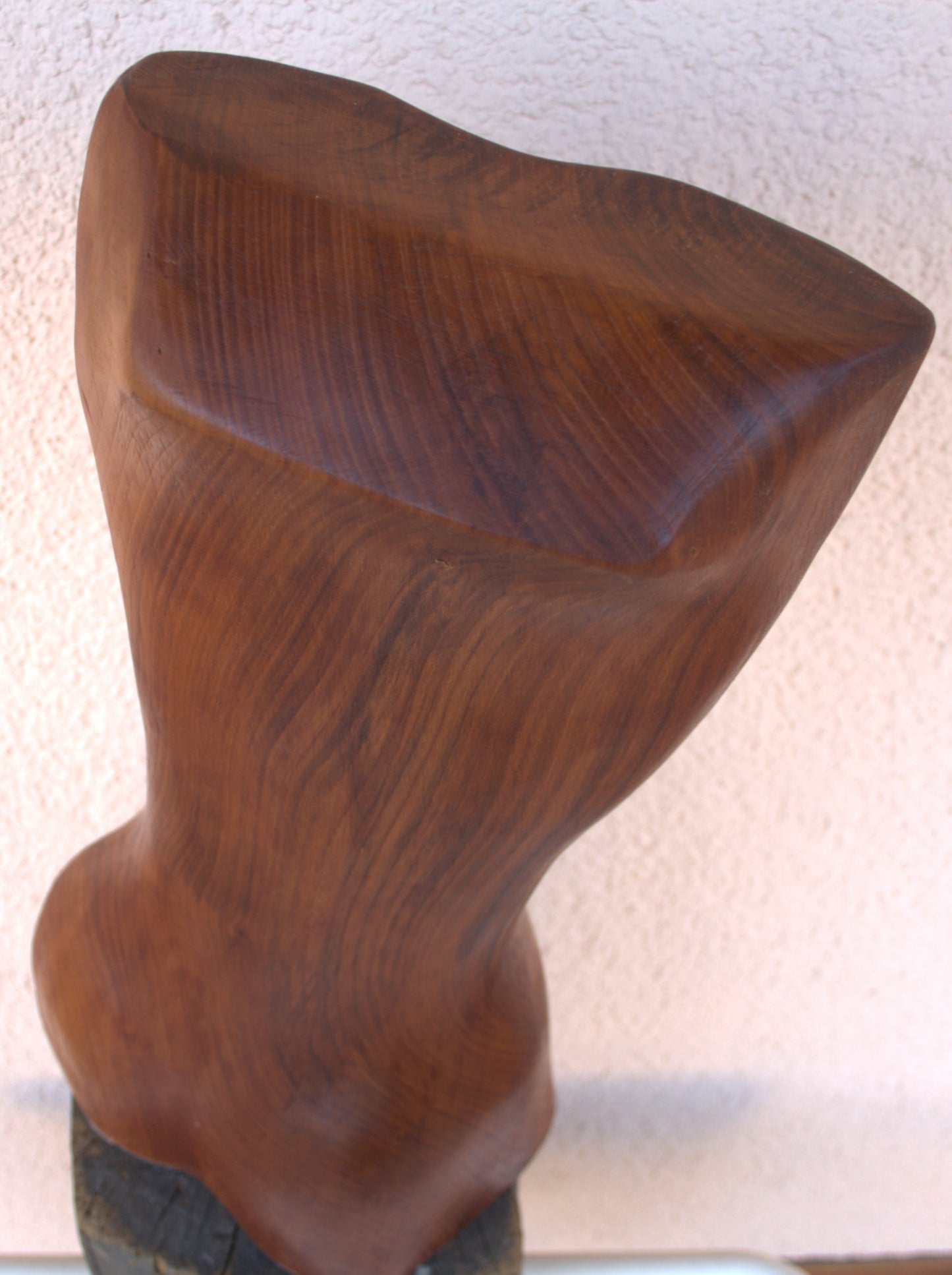 Female body. Optical illusion. Shapeshifter. An abstract figure made of American walnut. Living room decor. Wooden decoration. Wood art.