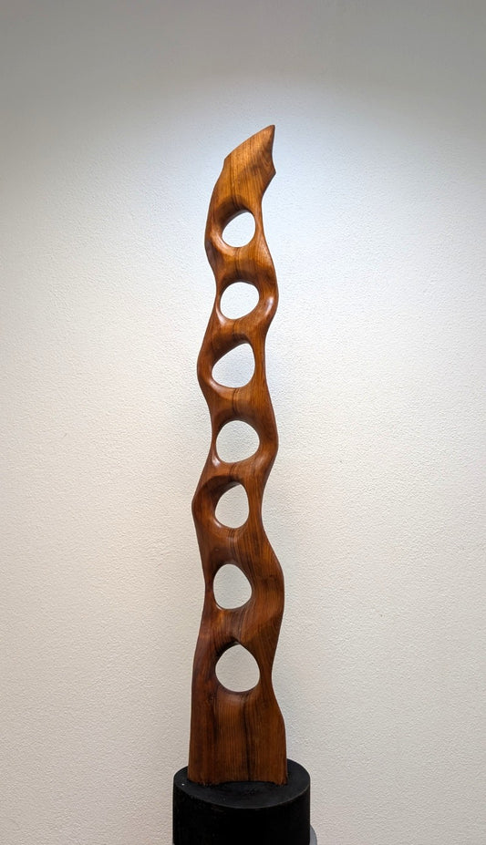 Babel. An abstract figure made of American walnut. Living room decor. Wooden decoration. Wood art.