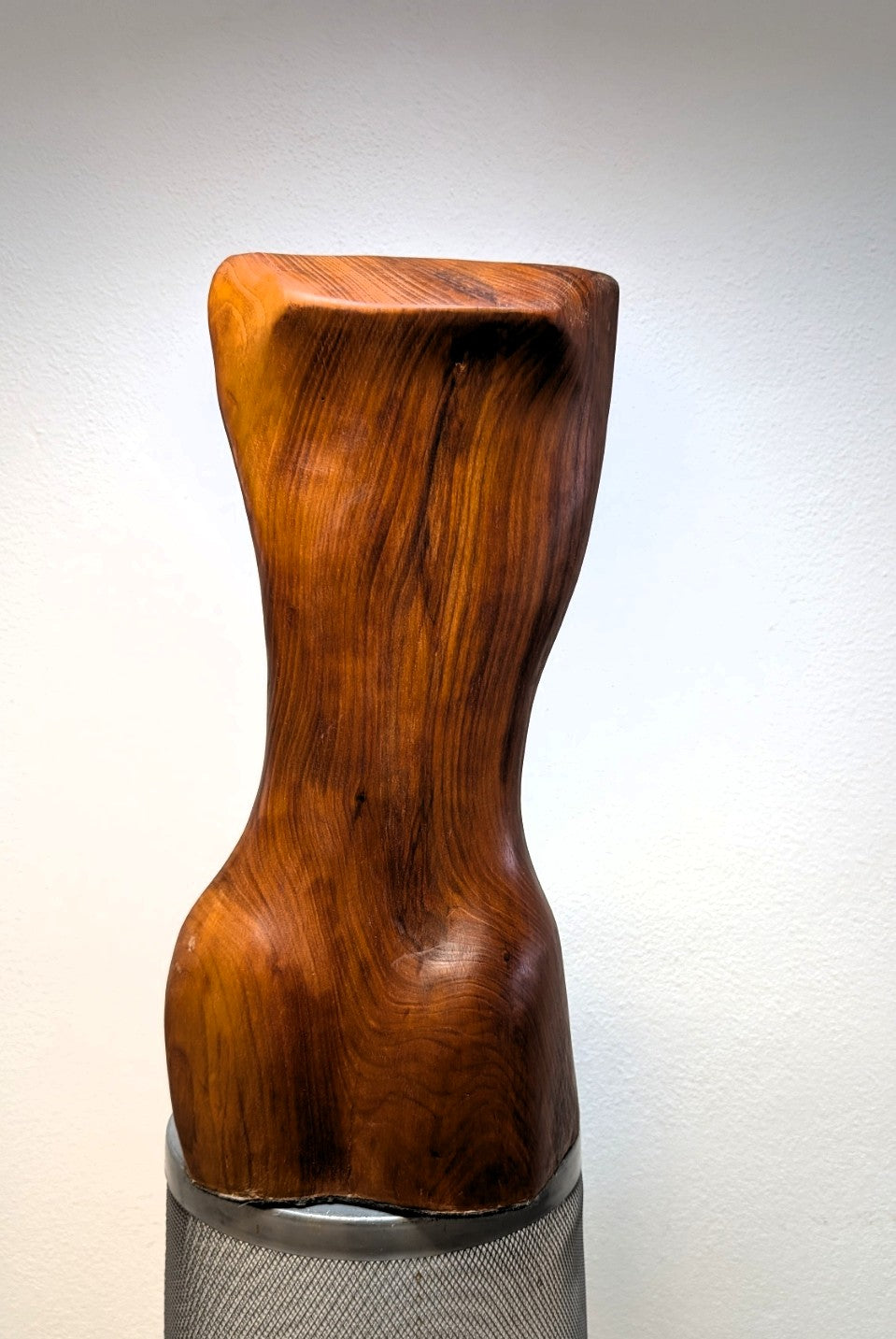 Female body. Optical illusion. Shapeshifter. An abstract figure made of American walnut. Living room decor. Wooden decoration. Wood art.