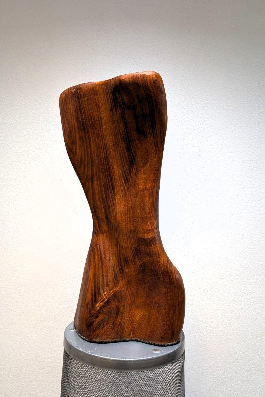 Female body. Optical illusion. Shapeshifter. An abstract figure made of American walnut. Living room decor. Wooden decoration. Wood art.
