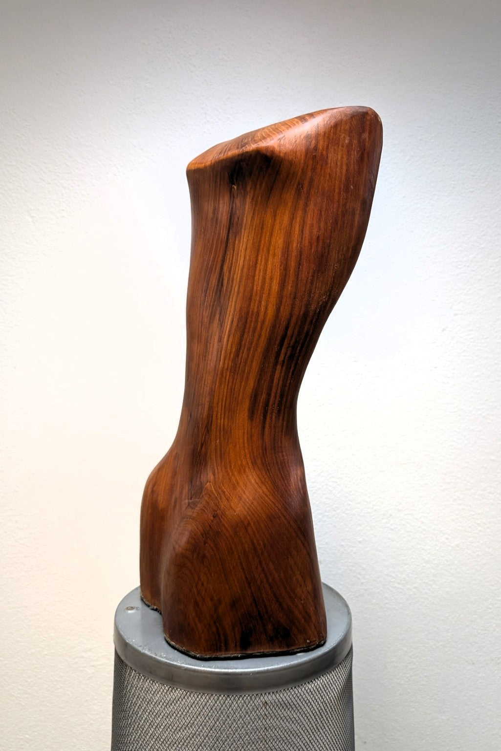 Female body. Optical illusion. Shapeshifter. An abstract figure made of American walnut. Living room decor. Wooden decoration. Wood art.
