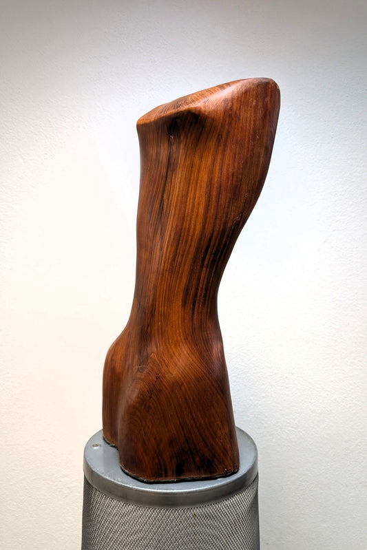 Female body. Optical illusion. Shapeshifter. An abstract figure made of American walnut. Living room decor. Wooden decoration. Wood art.