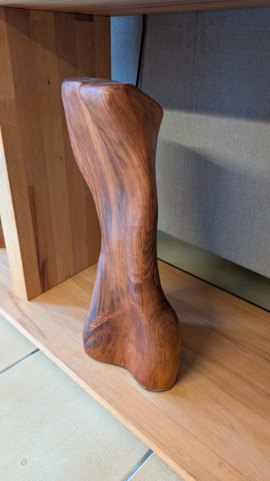 Female body. Optical illusion. Shapeshifter. An abstract figure made of American walnut. Living room decor. Wooden decoration. Wood art.